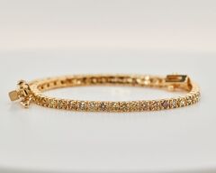 Tennisarmbånd Fancy naturlige Intens Gul / Brun diamanter 2.55 ct. 14 karat guld.