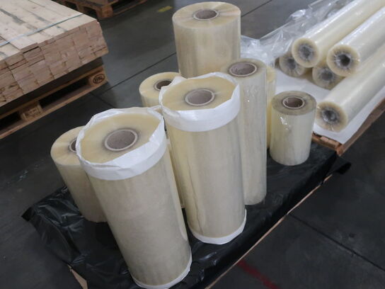 Misc. rolls of tape / plastic with adhesive.