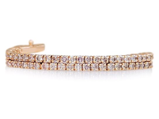 Tennisarmbånd med 94 stk. fancy pink diamanter 1.78 ct.,14 karat guld